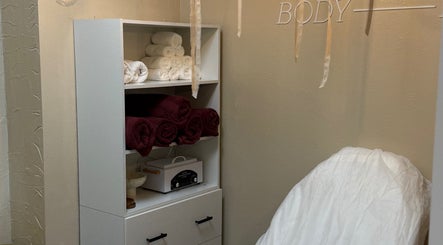 Cozy relaxation corner at Miro Beauty Clinic, Dublin15, County Dublin, IE, featuring plush towels and massage chair.