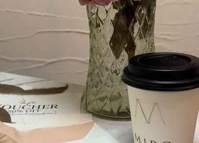 Coffee cup and voucher at Miro Beauty Clinic in Dublin15, County Dublin, IE, enhancing customer experience.