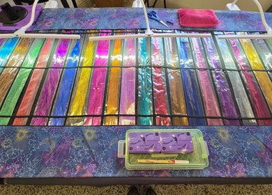 Variety of colorful hair threads displayed at SBTS Fairy Hair - Nicked Knacks Mercantile, Mount Dora, Florida, US.