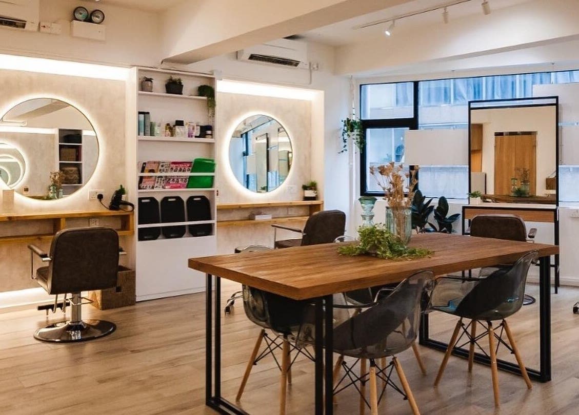 Interior of Sozo Hair Design, Hong Kong Island, HK featuring stylish chairs and mirrors in a chic setting.