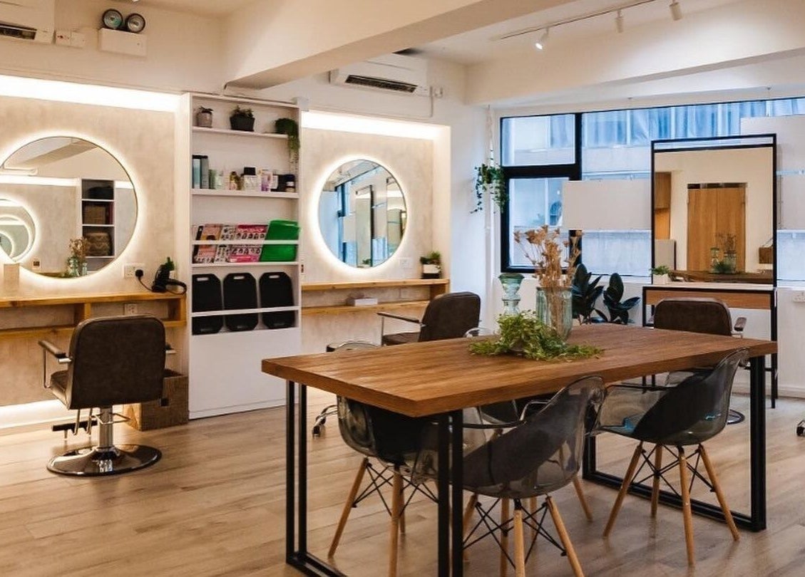 Interior of Sozo Hair Design, Hong Kong Island, HK featuring stylish chairs and mirrors in a chic setting.