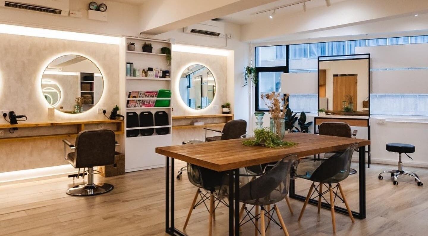 Interior of Sozo Hair Design, Hong Kong Island, HK featuring stylish chairs and mirrors in a chic setting.