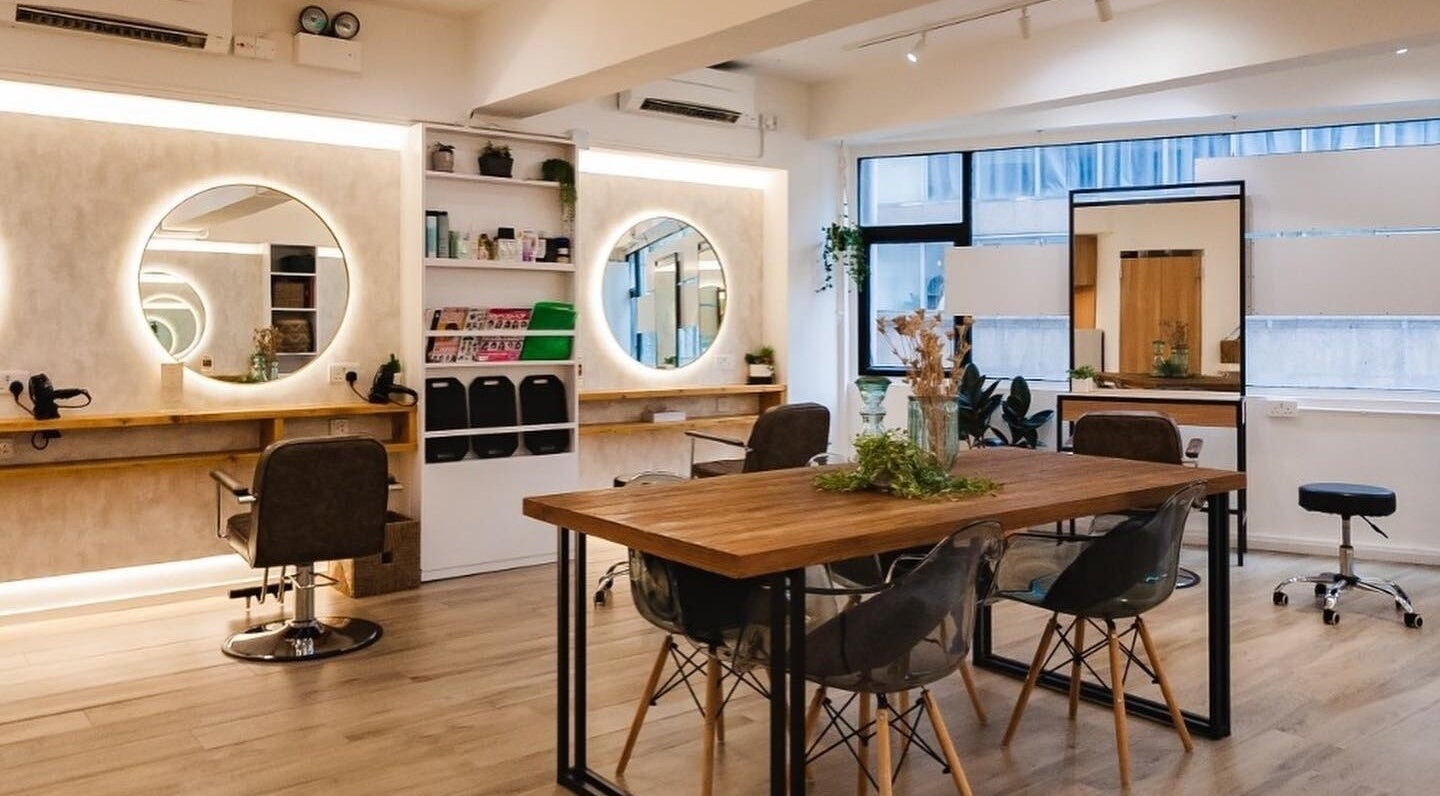 Interior of Sozo Hair Design, Hong Kong Island, HK featuring stylish chairs and mirrors in a chic setting.
