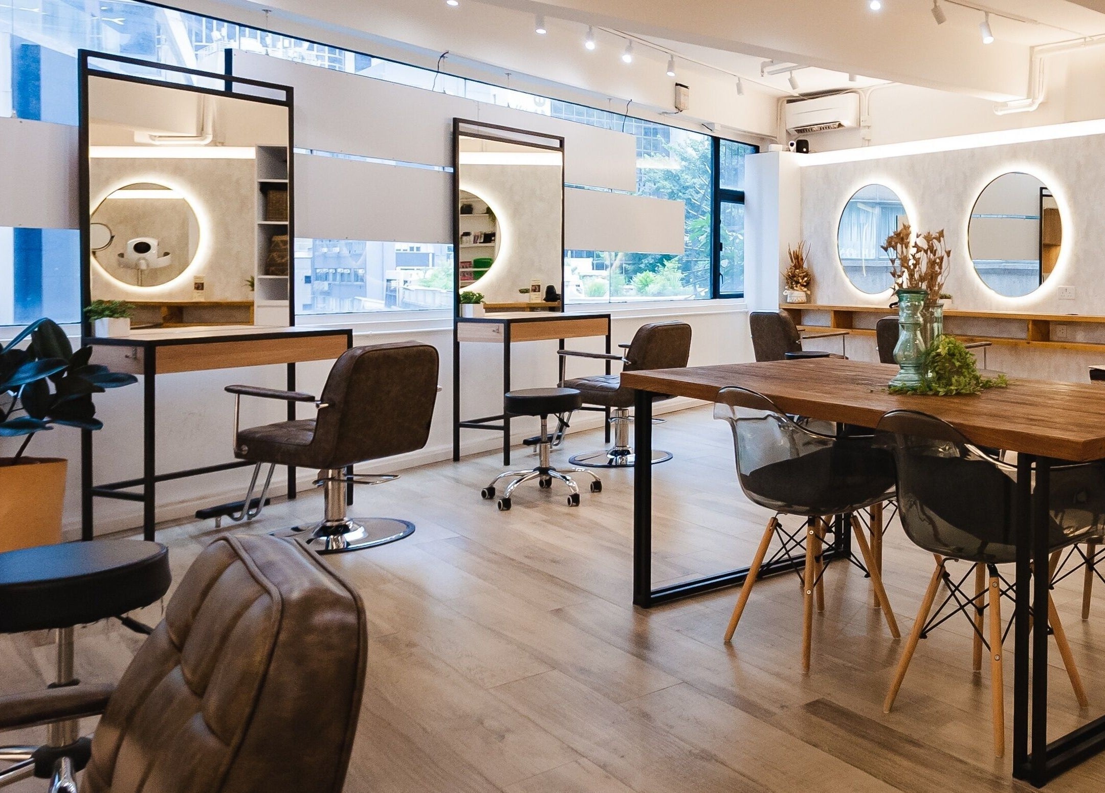 Modern interior of Sozo Hair Design on Hong Kong Island with stylish decor and salon chairs.