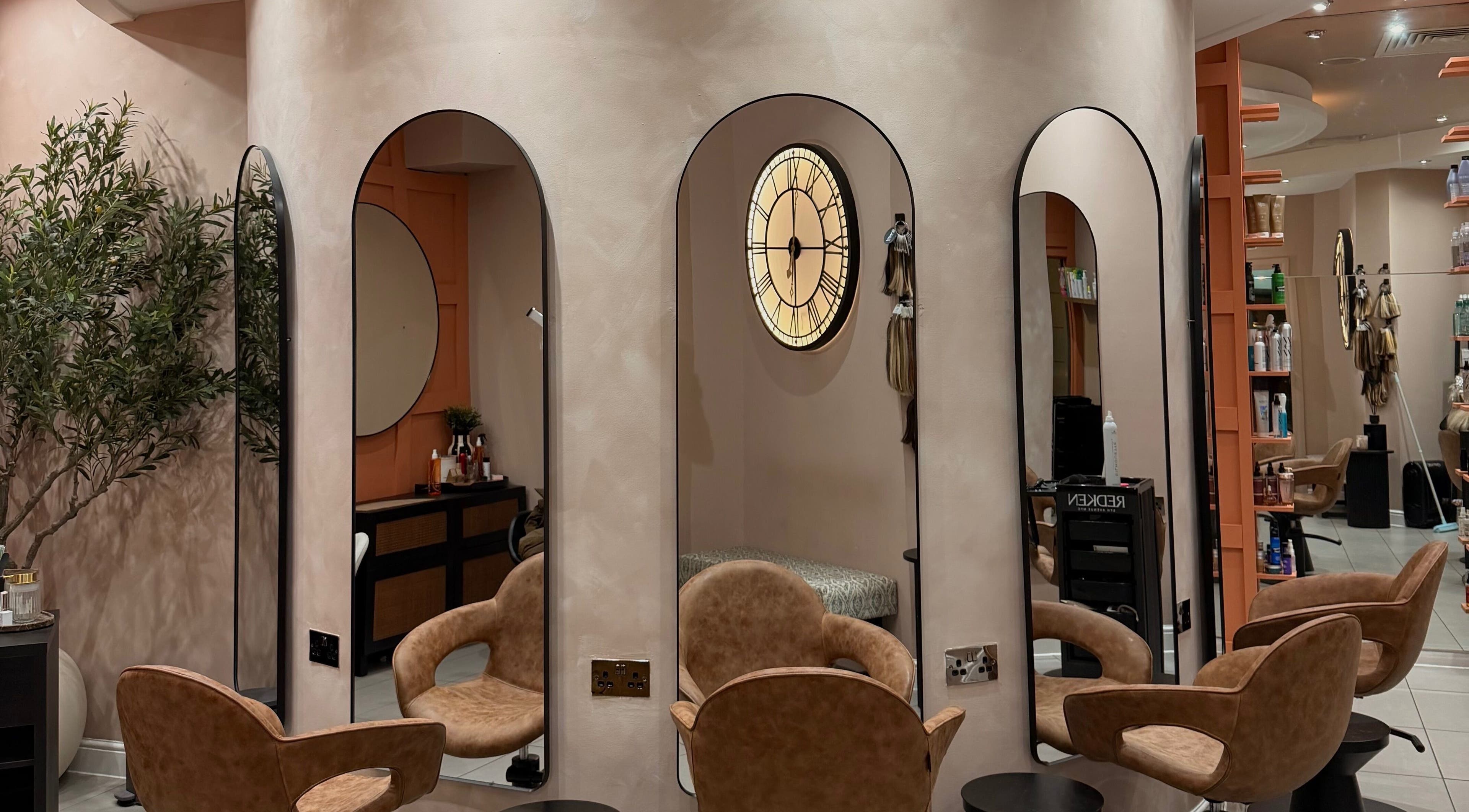 Chic interior of Element Hair Lounge in Hamilton, Scotland, GB, showcasing stylish chairs and mirrors.