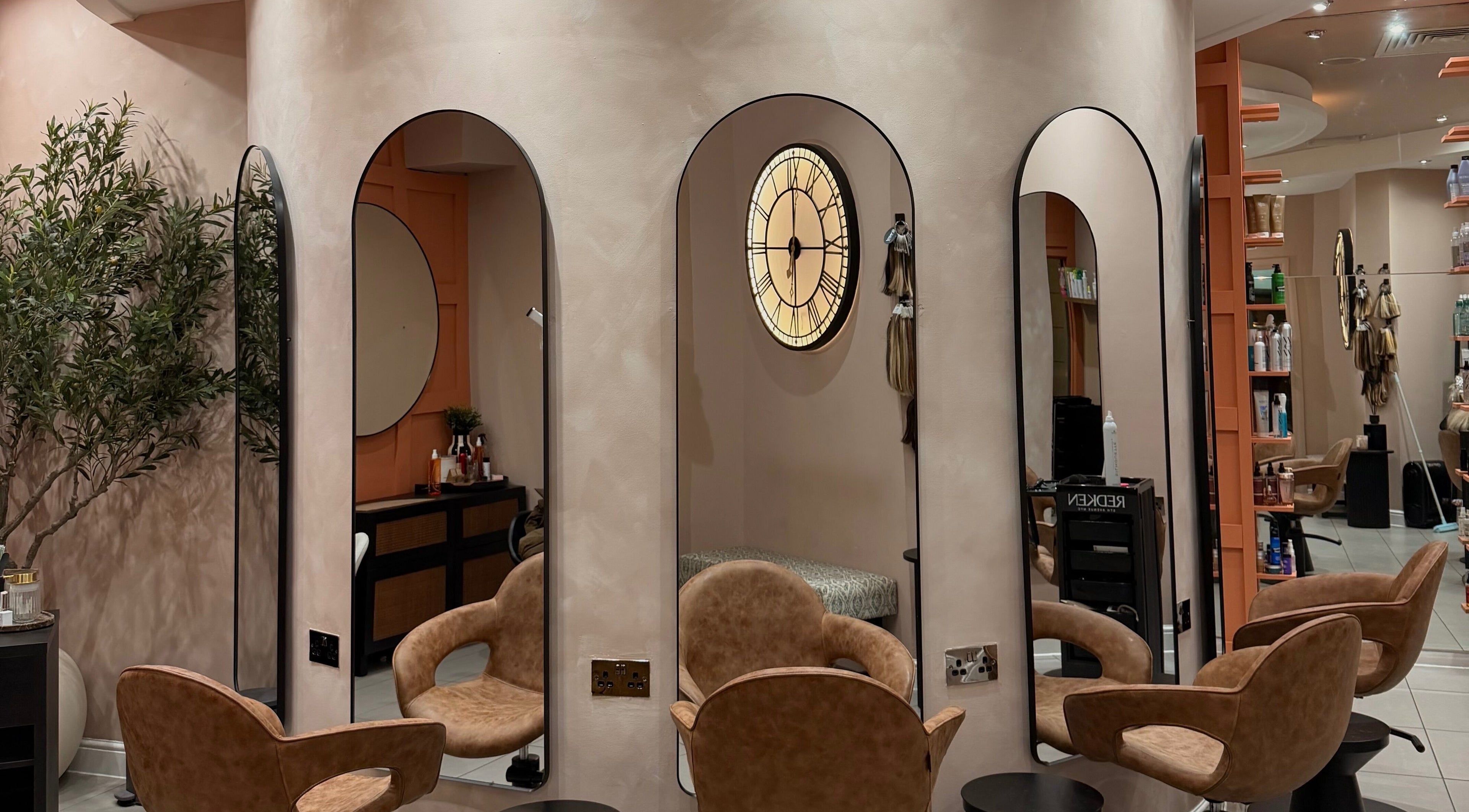 Chic interior of Element Hair Lounge in Hamilton, Scotland, GB, showcasing stylish chairs and mirrors.