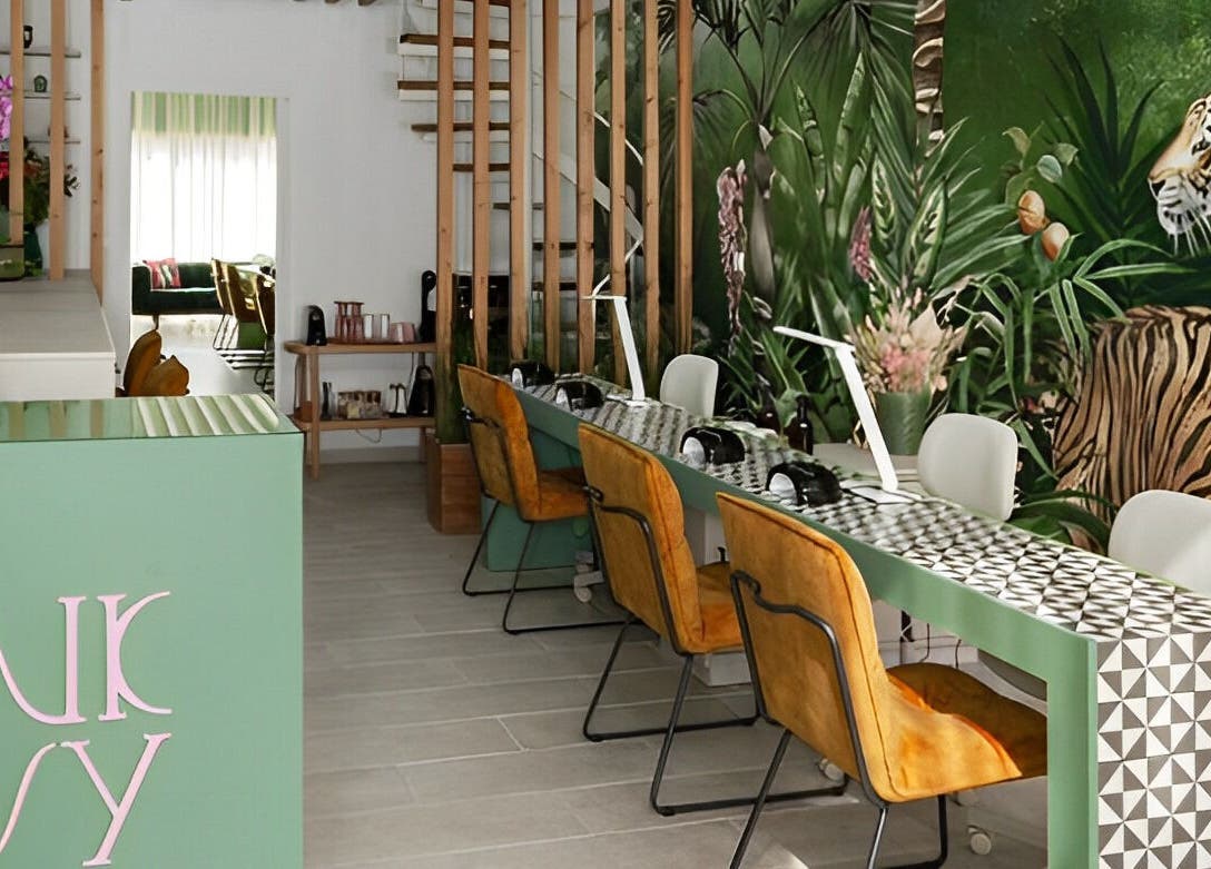 Stylish interior of Pink Ivy with tropical mural and sleek design in Στρόβολος, Λευκωσία, CY.