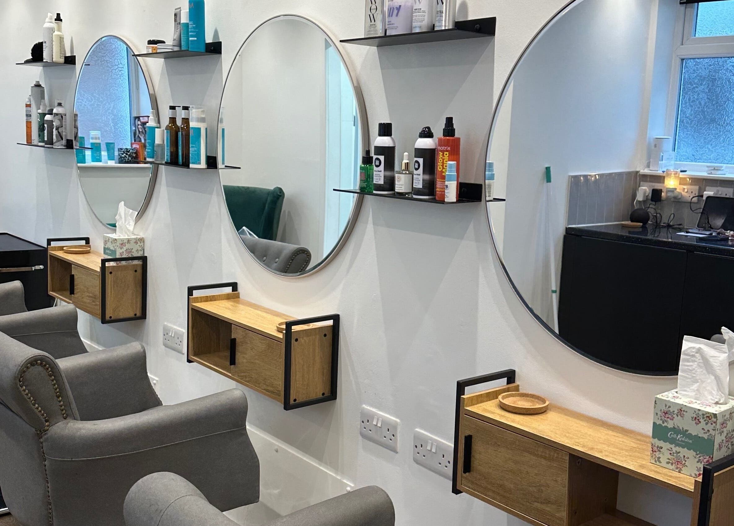 Modern salon chairs and mirrors at Science Behind Hairdressing, Wolverhampton, England, GB.