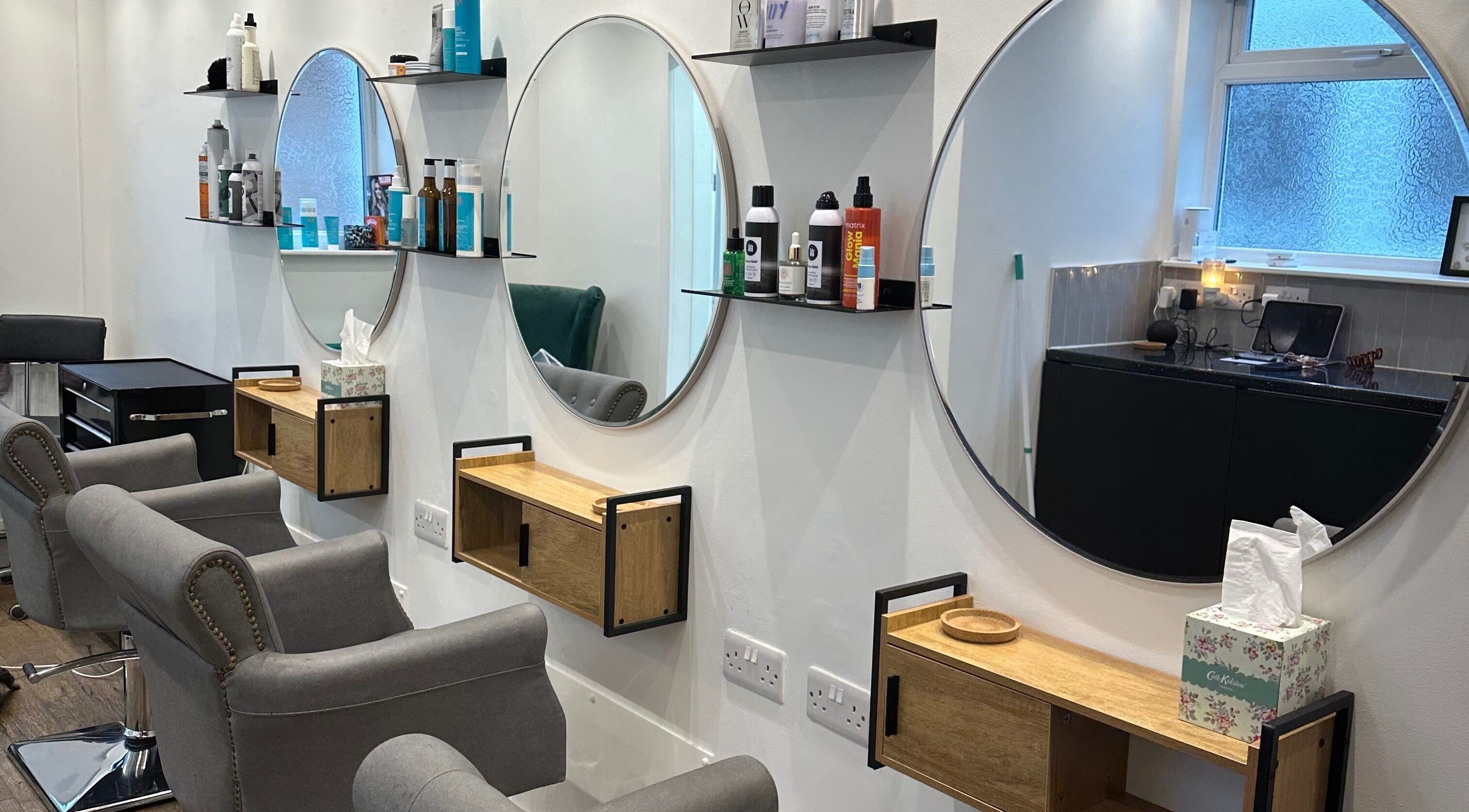 Modern salon chairs and mirrors at Science Behind Hairdressing, Wolverhampton, England, GB.