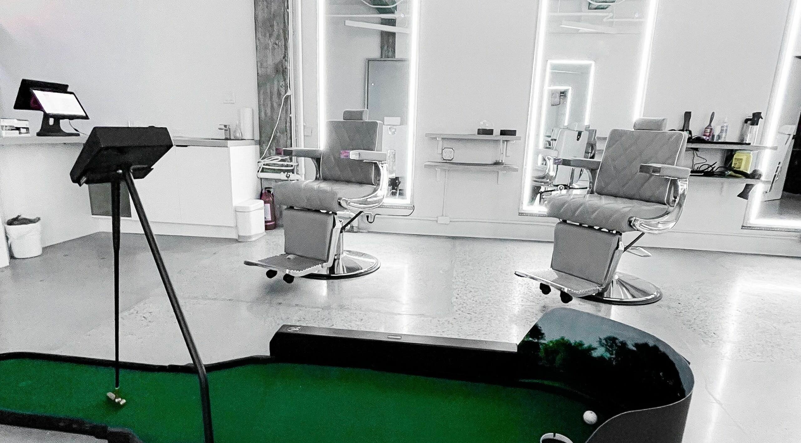Modern salon chairs and putt area at Members Only, Vancouver, British Columbia, CA.
