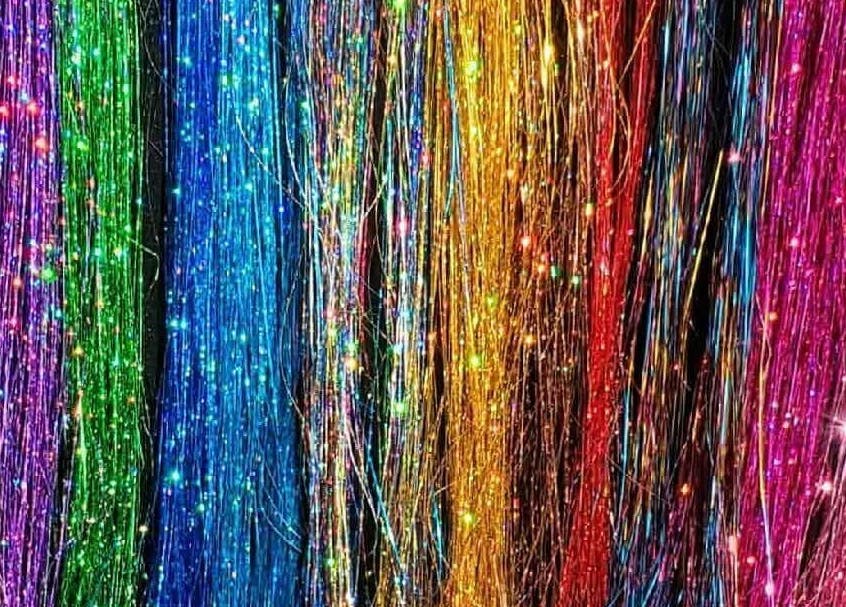 Colorful hair tinsel display at The Fairy Hair Godmother®️ in High Point, North Carolina, US.