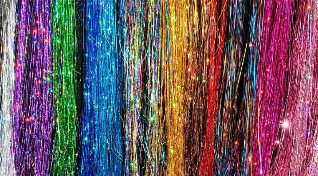 Colorful hair tinsel display at The Fairy Hair Godmother®️ in High Point, North Carolina, US.