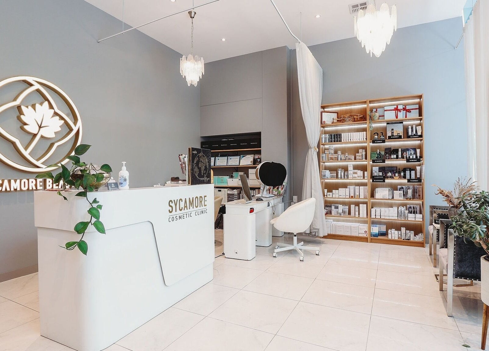 Reception area of Sycamore Medi Spa - Civic, Canberra, featuring elegant decor and product shelves.