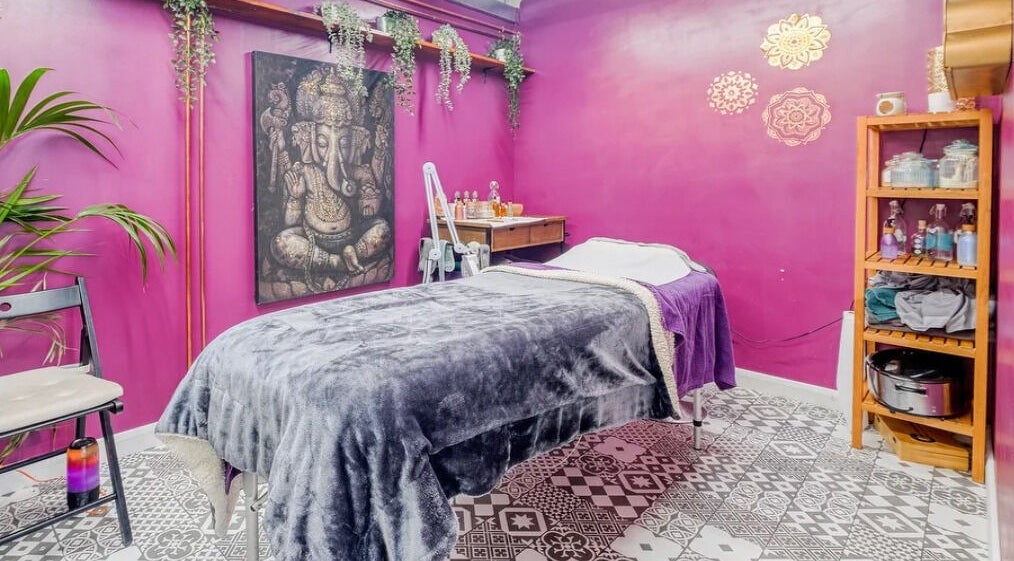 Relaxing massage room with vibrant decor at Aura Organics Spa Hackney Wick, London, England, GB.