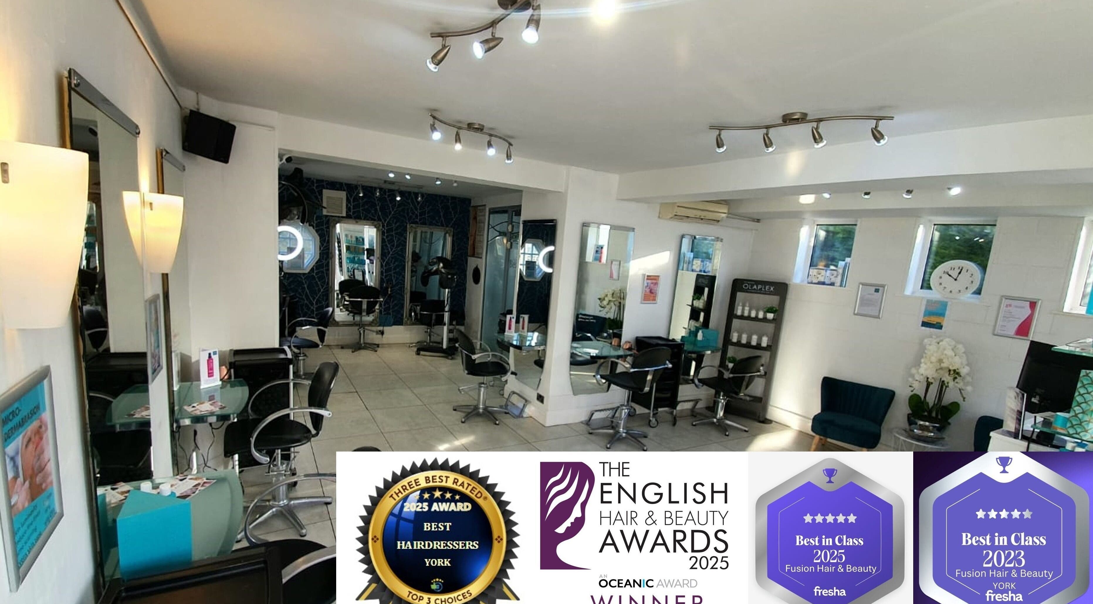Interior of Haze Hair and Beauty, York, England, showcasing elegant styling stations and awards.