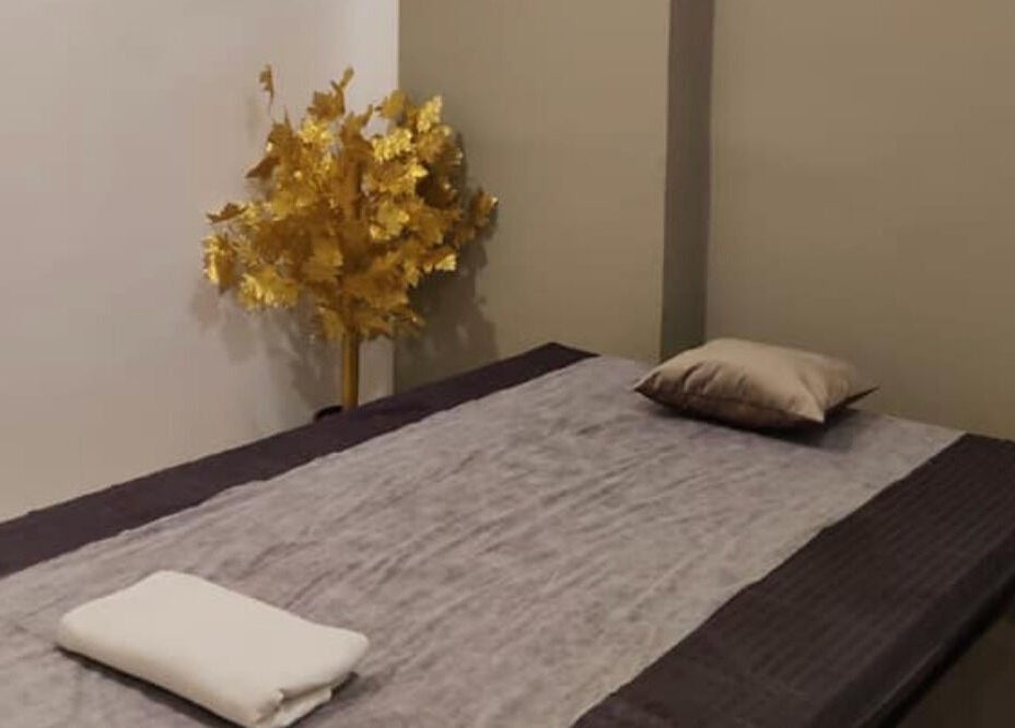Tranquil spa room with a massage bed at Absolute Ace Unisex Spa and Salon, Raipur, Chhattisgarh, IN.