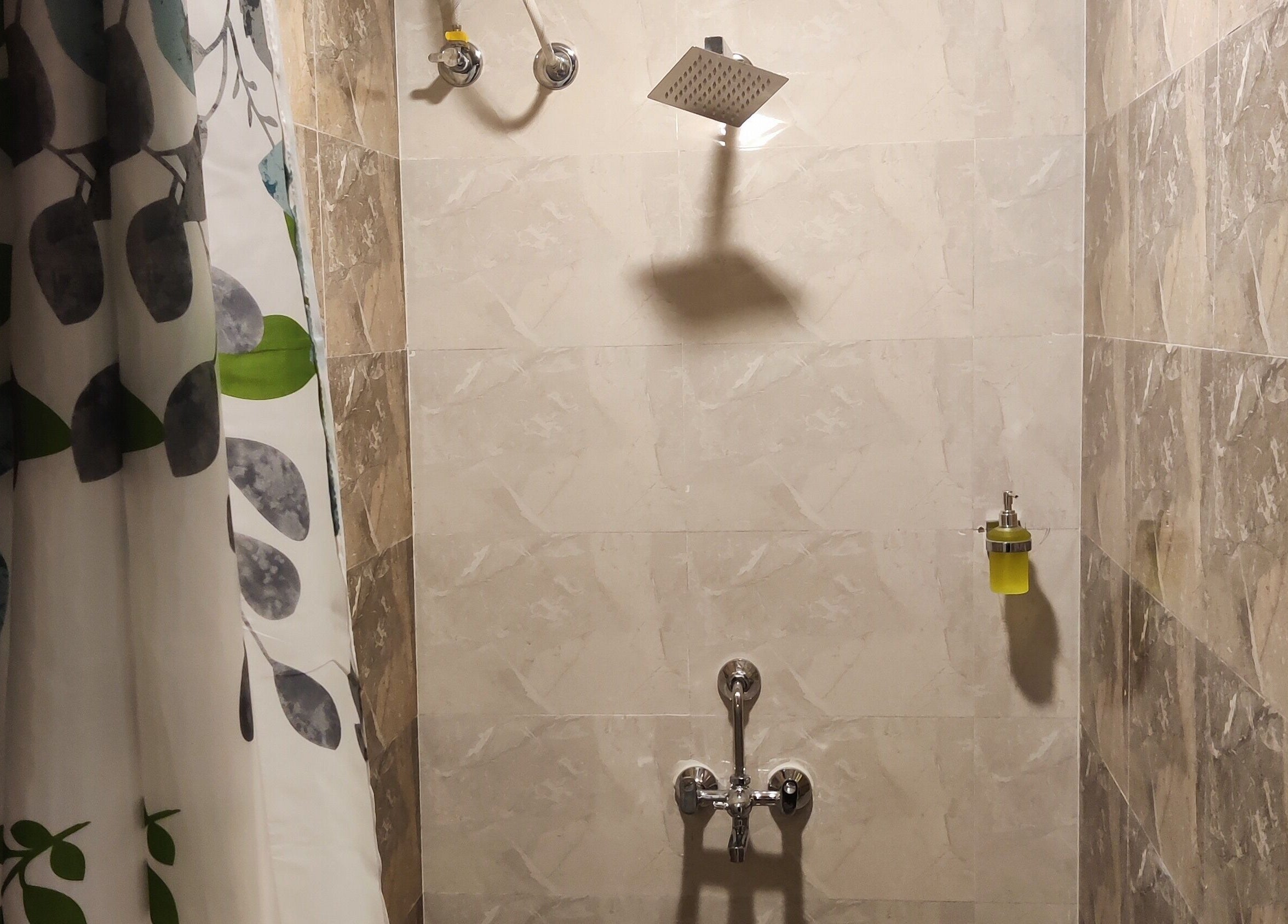 Elegant shower area in Absolute Ace Unisex Spa and Salon, Raipur, Chhattisgarh, IN, featuring stylish tiles.