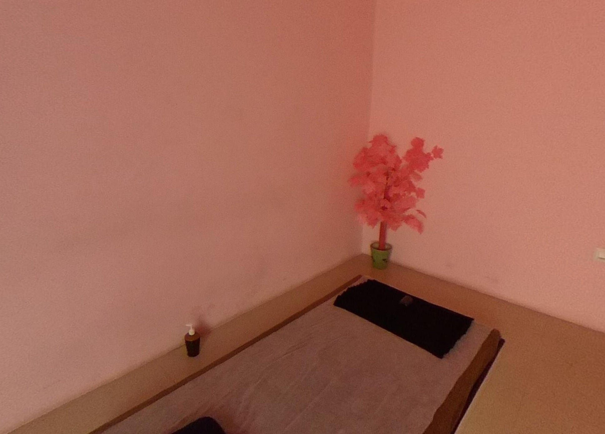 Relaxing pink-themed spa room at Absolute Ace Unisex Spa and Salon in Raipur, Chhattisgarh, IN.