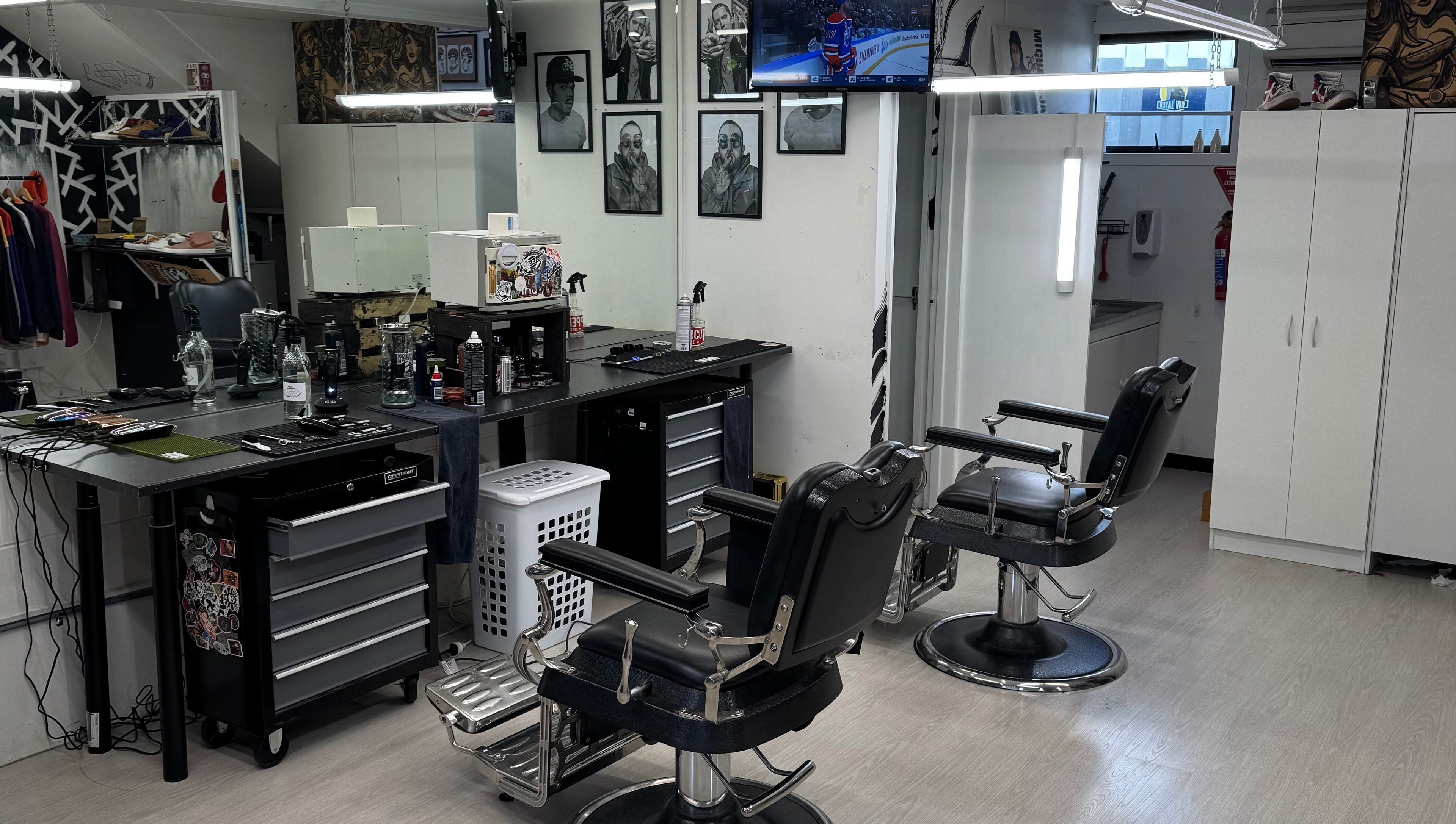 Modern interior of Three Diamonds Barbershop in Cromwell, Otago, NZ featuring stylish chairs and grooming stations.