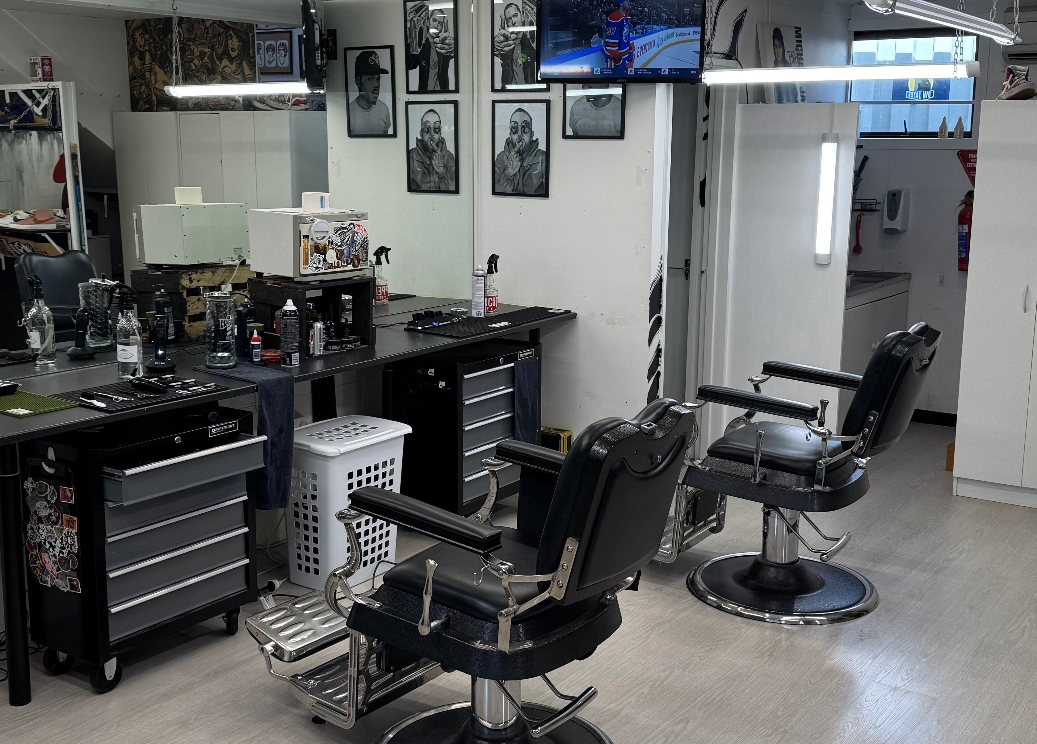 Modern interior of Three Diamonds Barbershop in Cromwell, Otago, NZ featuring stylish chairs and grooming stations.