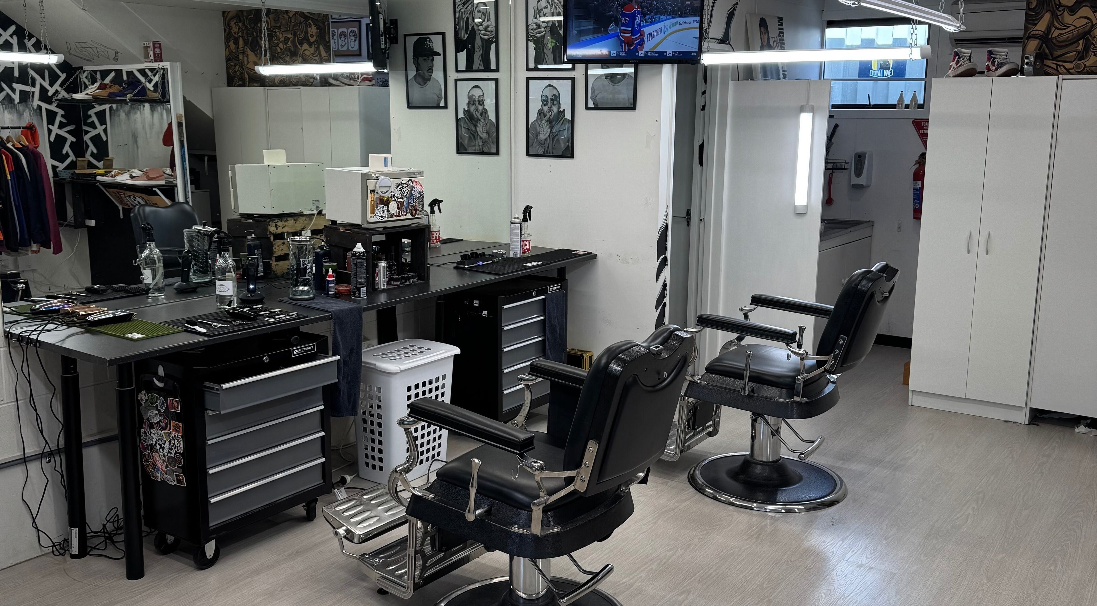 Modern interior of Three Diamonds Barbershop in Cromwell, Otago, NZ featuring stylish chairs and grooming stations.