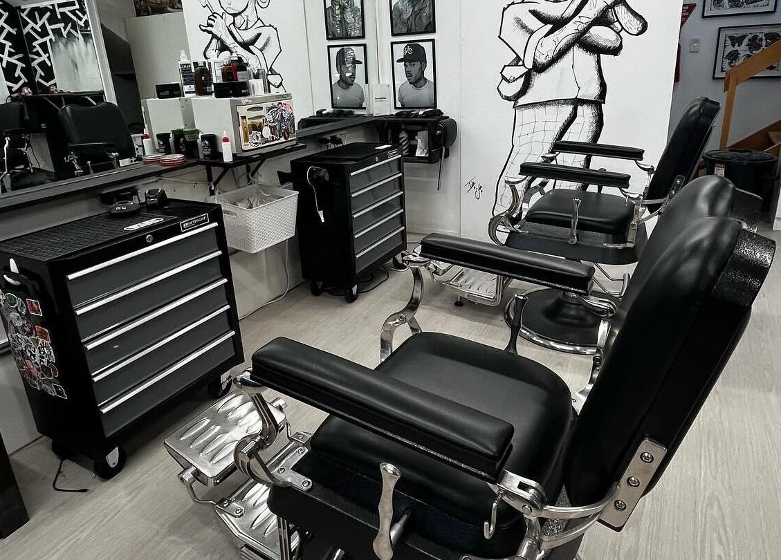 Modern barber chairs at Three Diamonds Barbershop, Cromwell, Otago, NZ, showcasing a sleek interior design.