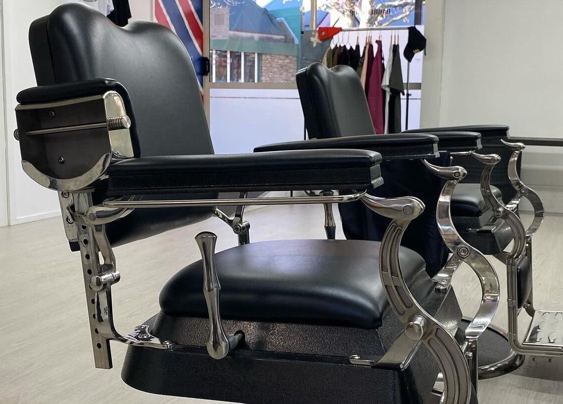 Classic barber chairs at Three Diamonds Barbershop, Cromwell, Otago, NZ, offering a vintage ambiance.