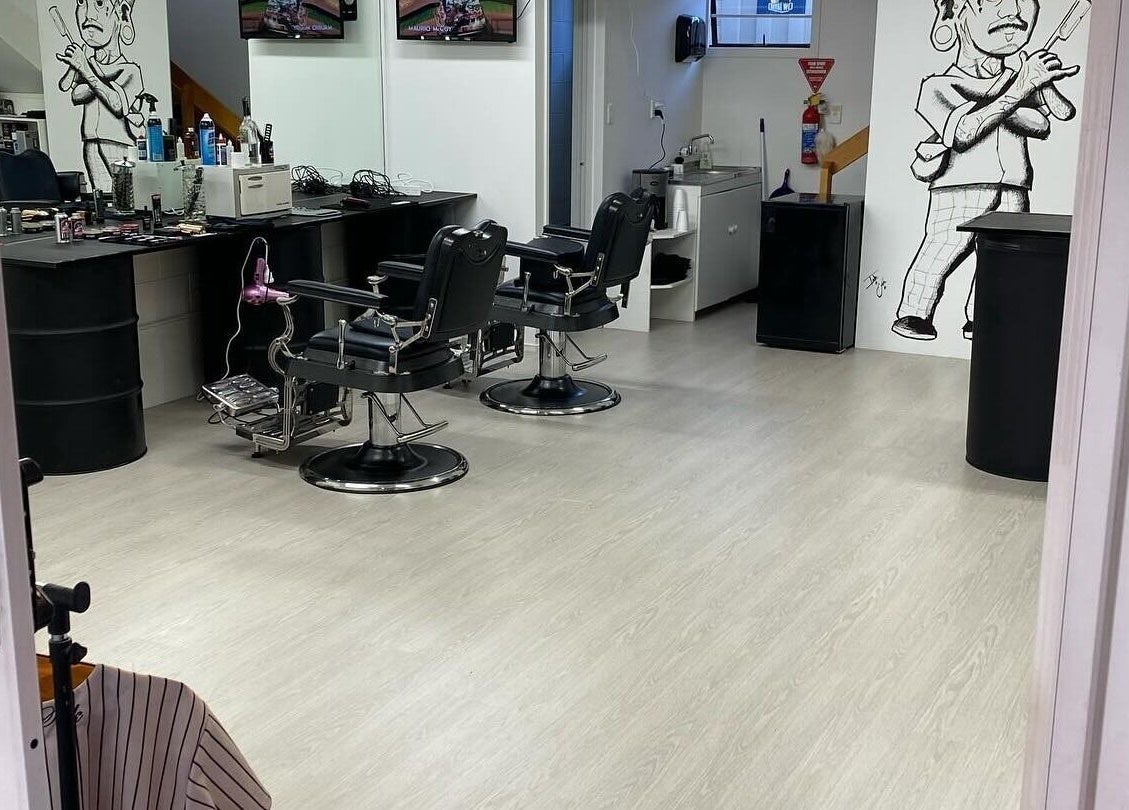 Stylish interior of Three Diamonds Barbershop in Cromwell, Otago, NZ featuring modern chairs and decor.