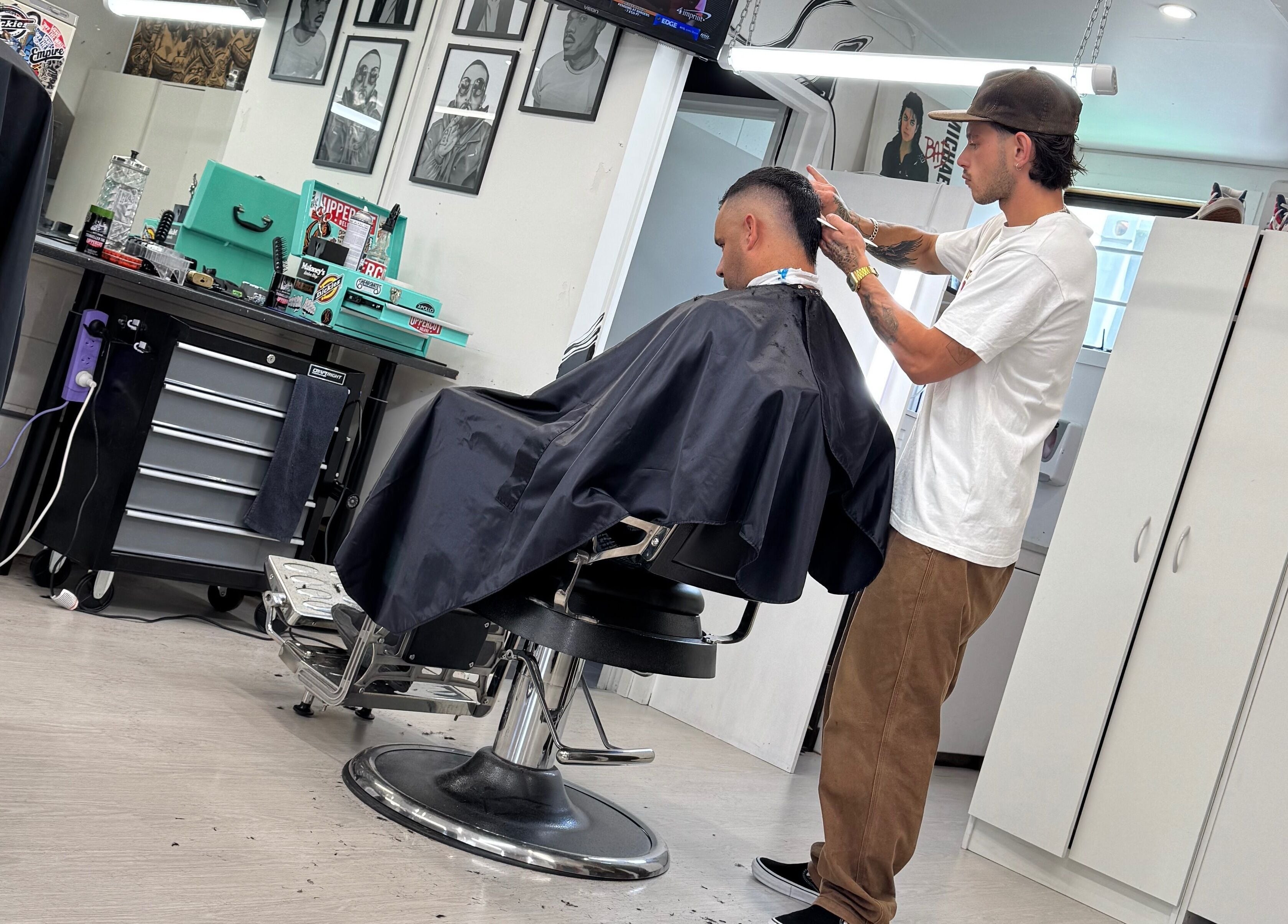 Three Diamonds Barbershop stylist grooming client in Cromwell, Otago, NZ.