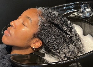Client enjoys a relaxing shampoo experience at Opulence TORONTO pop-up, Toronto, Ontario, CA.