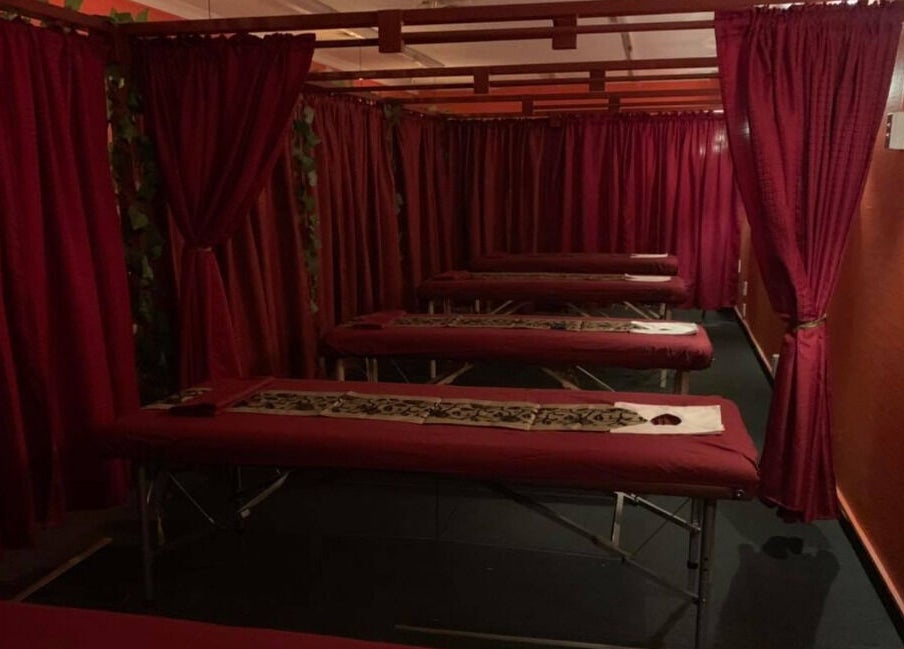 Tranquil massage room at Bamboo Spa Lower Hutt Wellington, featuring elegant red curtains. Lower Hutt, Wellington, NZ.