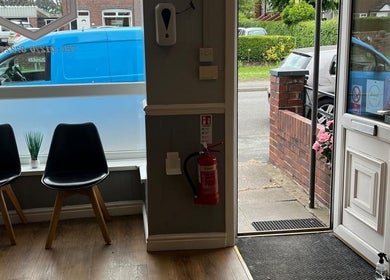JB Hair entrance area with chairs and decor in Rode Heath, England, GB.
