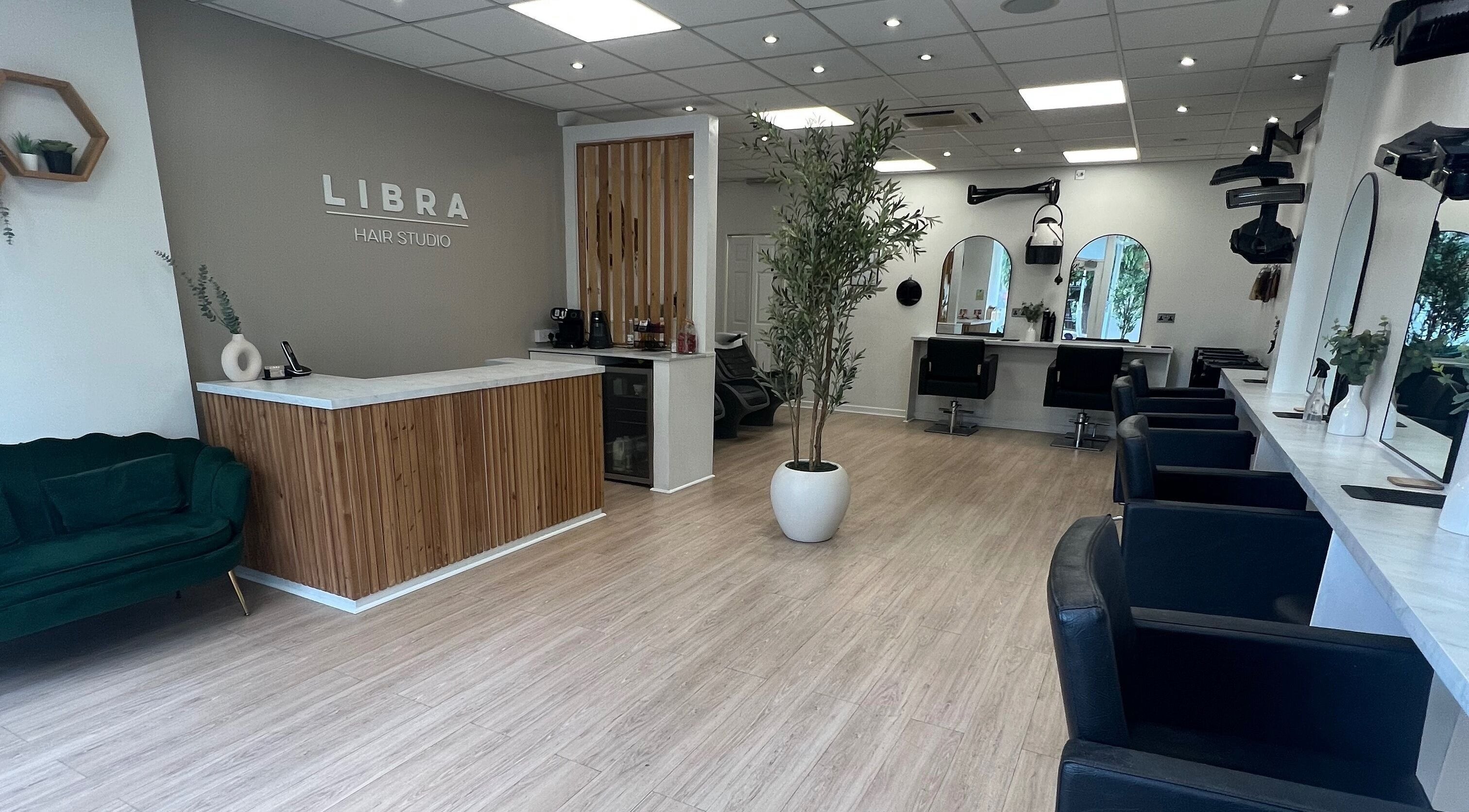 Elegant interior of Libra Hair Studio in Melksham, England. Modern decor with sleek salon furniture.
