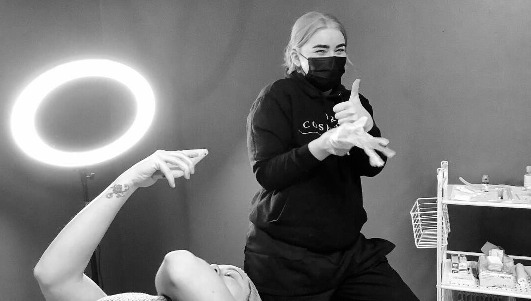 ELR Cosmetics staff member smiling with a client at Liverpool, England, GB skincare studio.