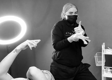 ELR Cosmetics staff member smiling with a client at Liverpool, England, GB skincare studio.