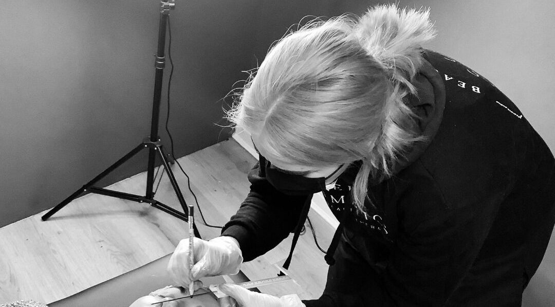 Professional performing microblading at ELR Cosmetics, Liverpool, England, GB, enhancing beauty precision.