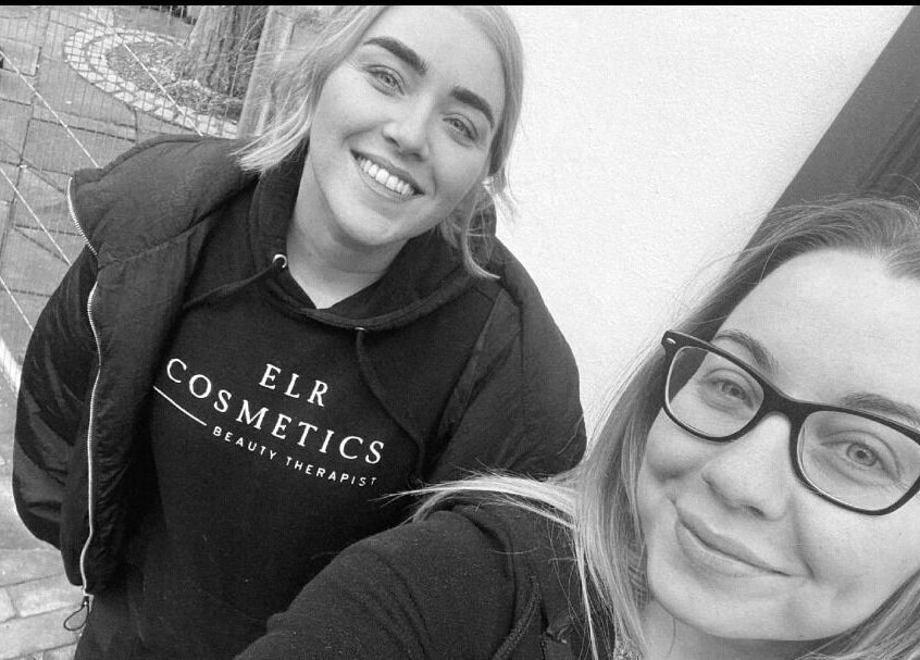 Team members smiling outside ELR Cosmetics in Liverpool, England, GB.