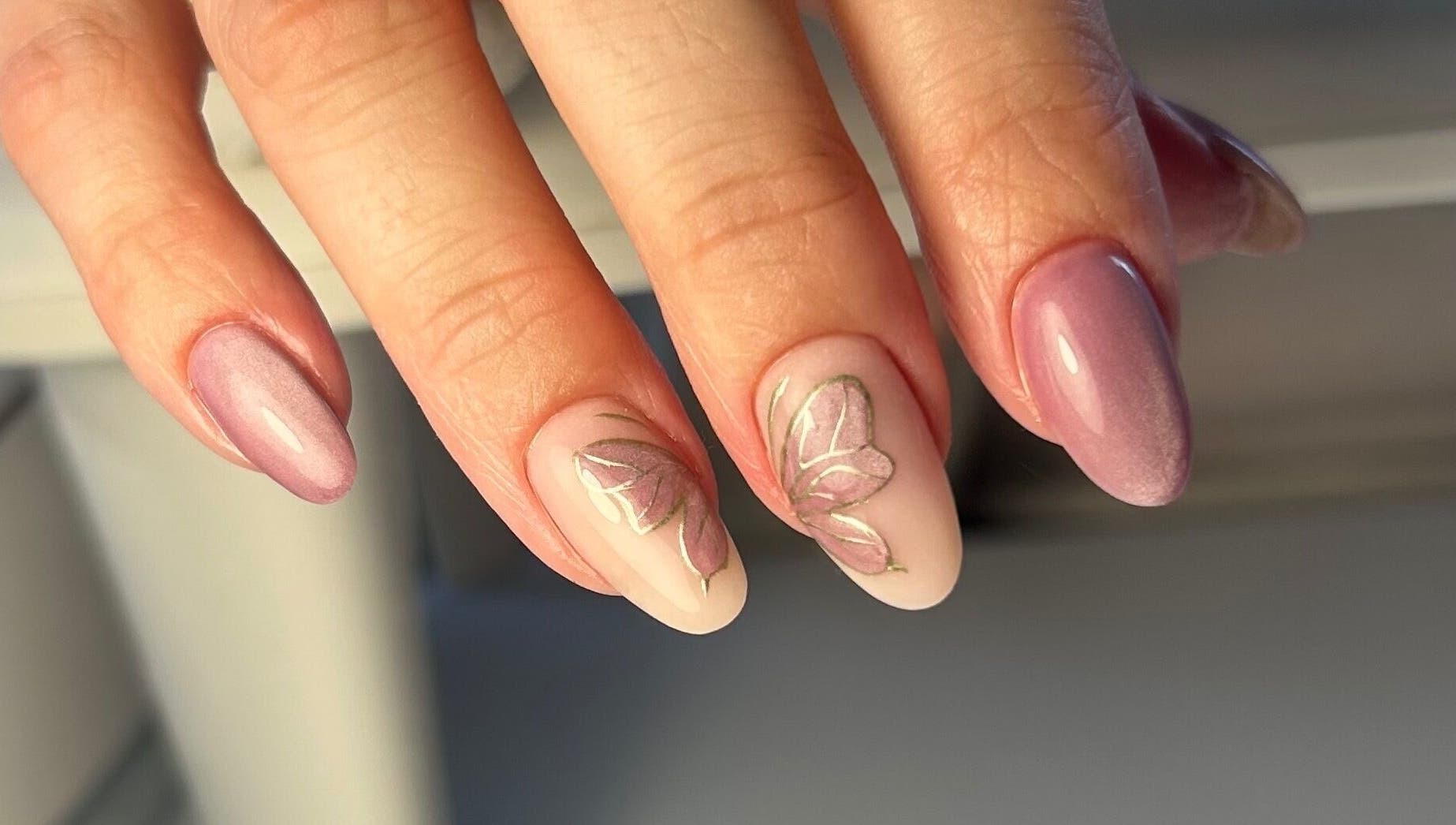 Elegant floral nail art at Nails by Hallie, Four Lanes, England, GB. Perfect for a stylish manicure.
