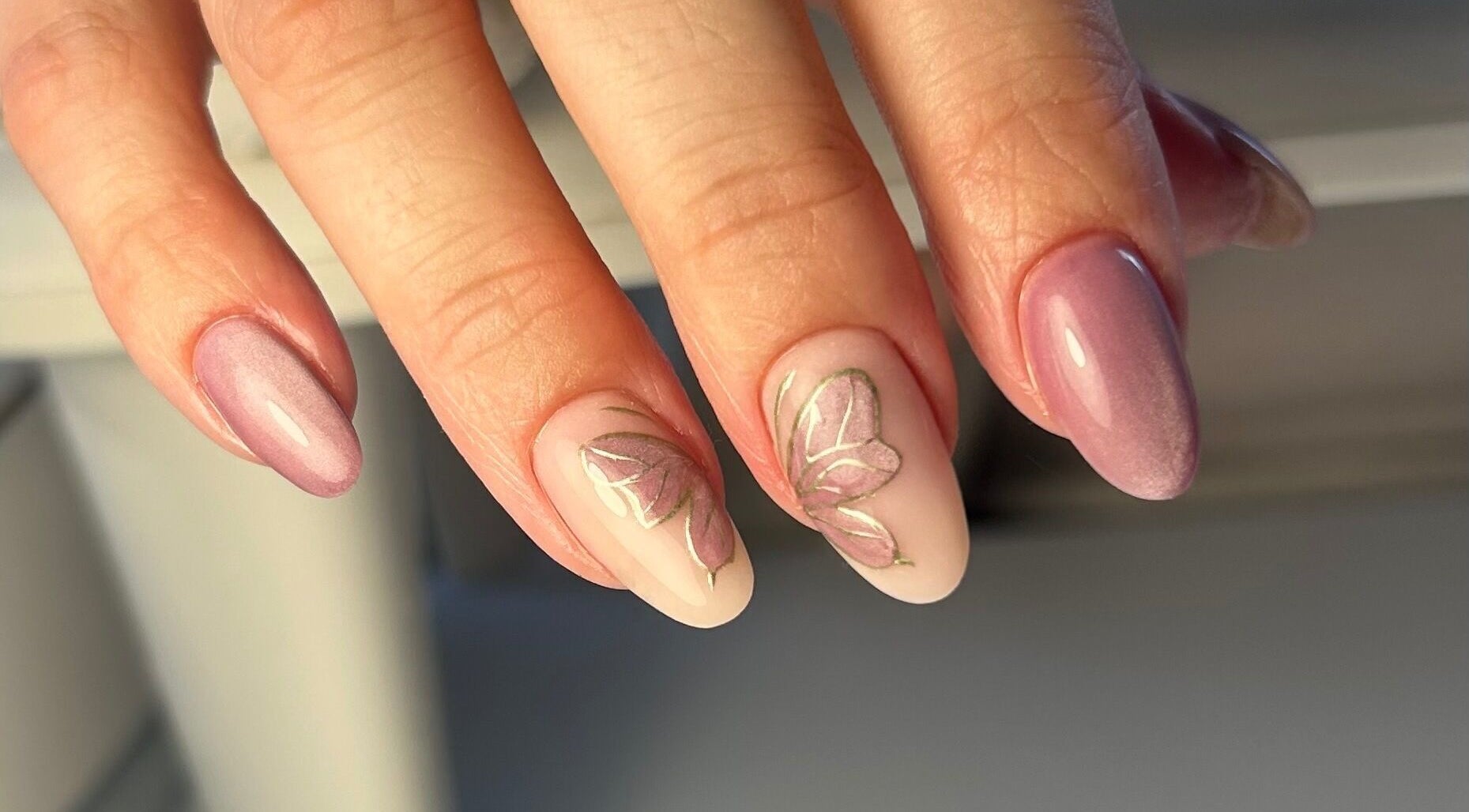 Elegant floral nail art at Nails by Hallie, Four Lanes, England, GB. Perfect for a stylish manicure.