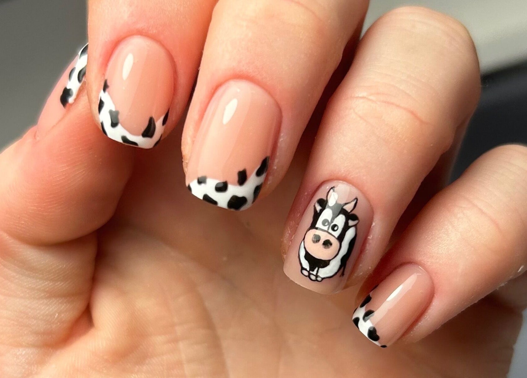 Unique cow print nail art by Nails by Hallie at Four Lanes, England, GB. Charming and stylish manicure design.