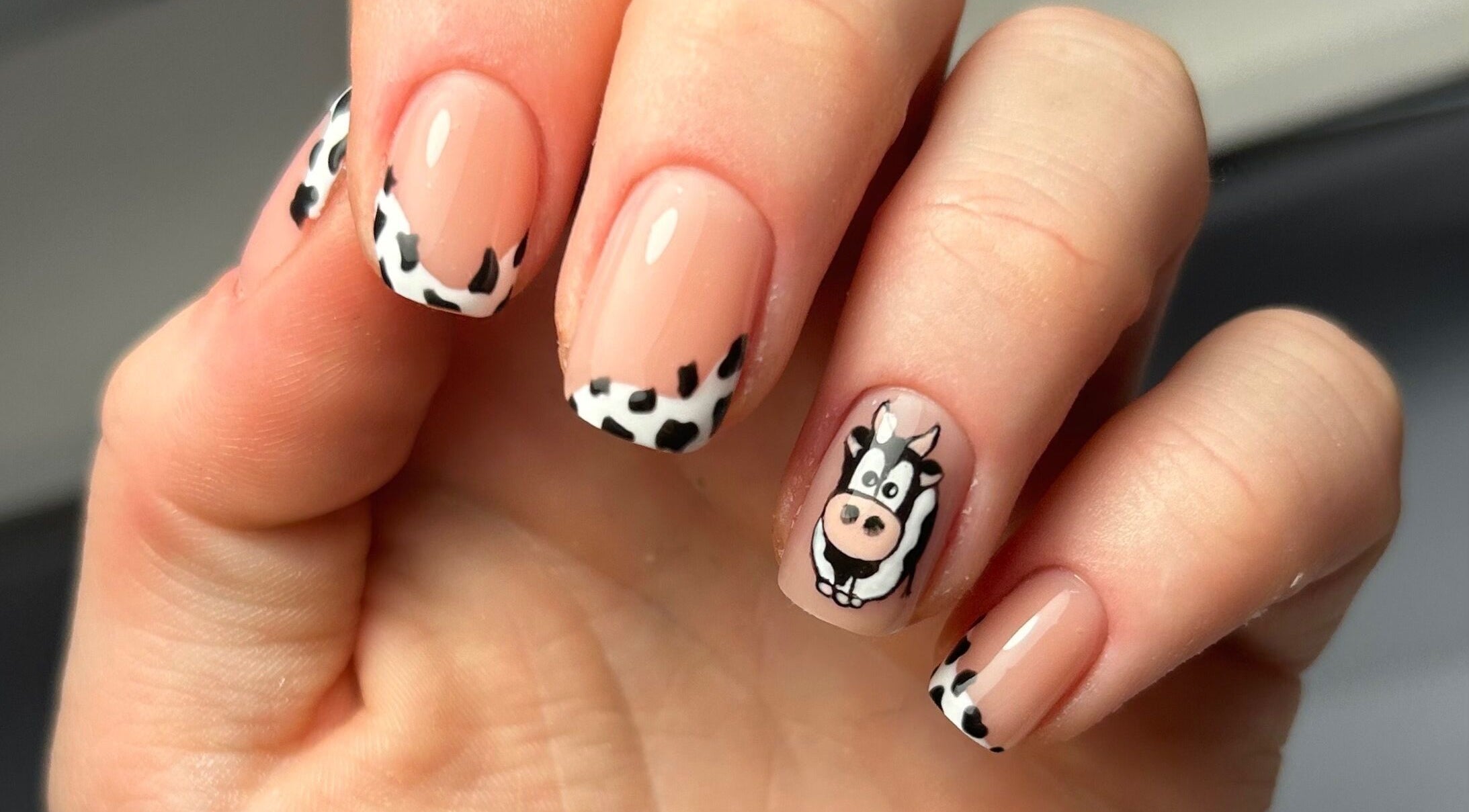 Unique cow print nail art by Nails by Hallie at Four Lanes, England, GB. Charming and stylish manicure design.