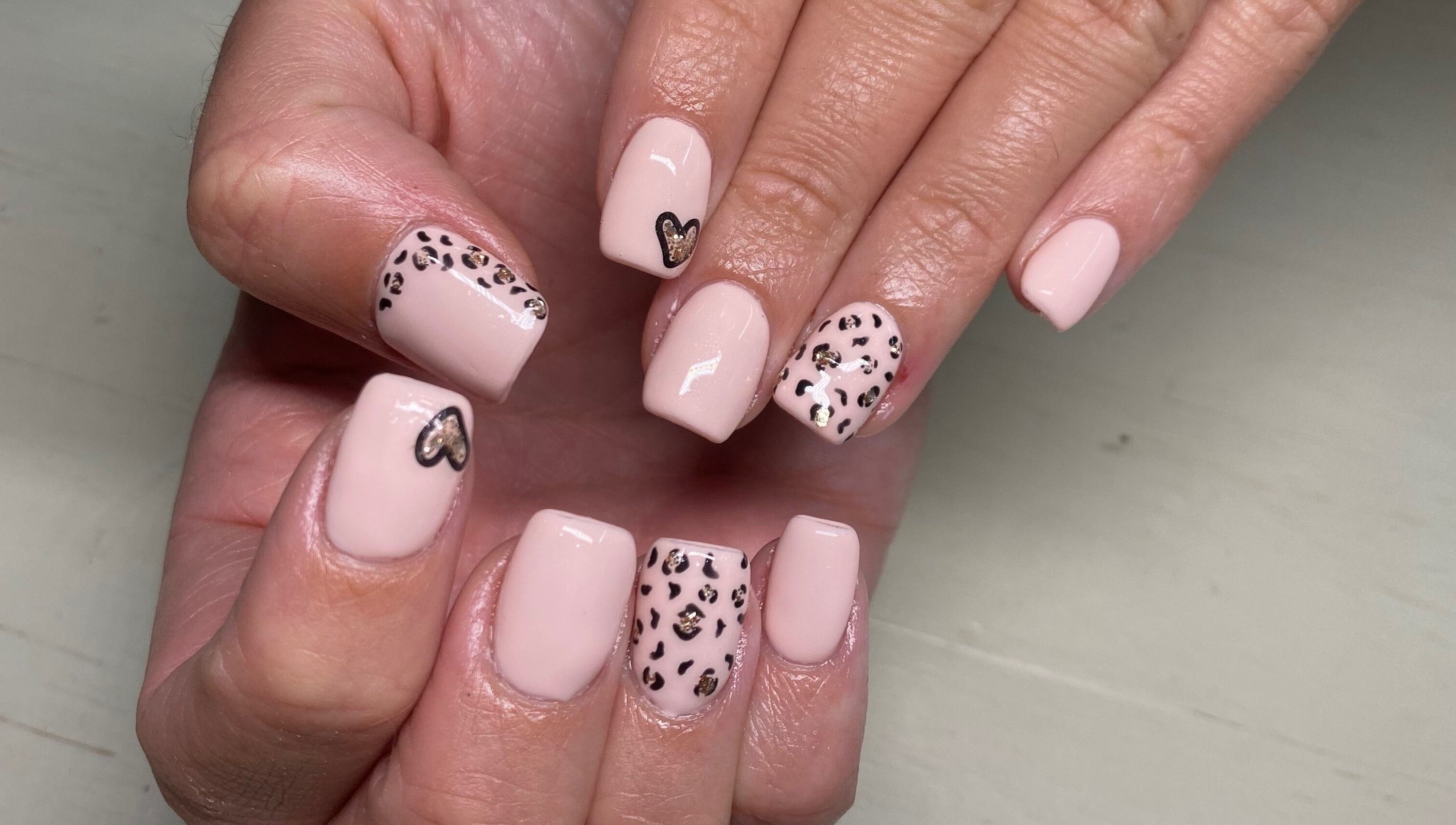 Elegant leopard print gel nails at Naked Nails, Pretoria, Gauteng, ZA. Perfect for a trendy, stylish look.