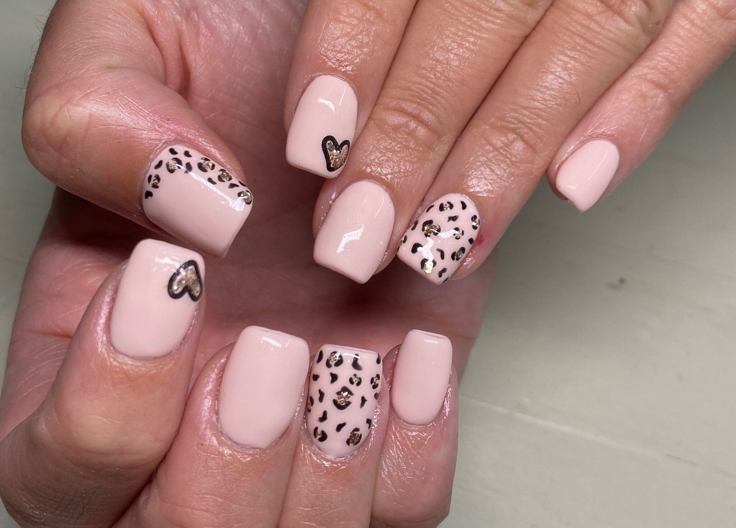 Elegant leopard print gel nails at Naked Nails, Pretoria, Gauteng, ZA. Perfect for a trendy, stylish look.