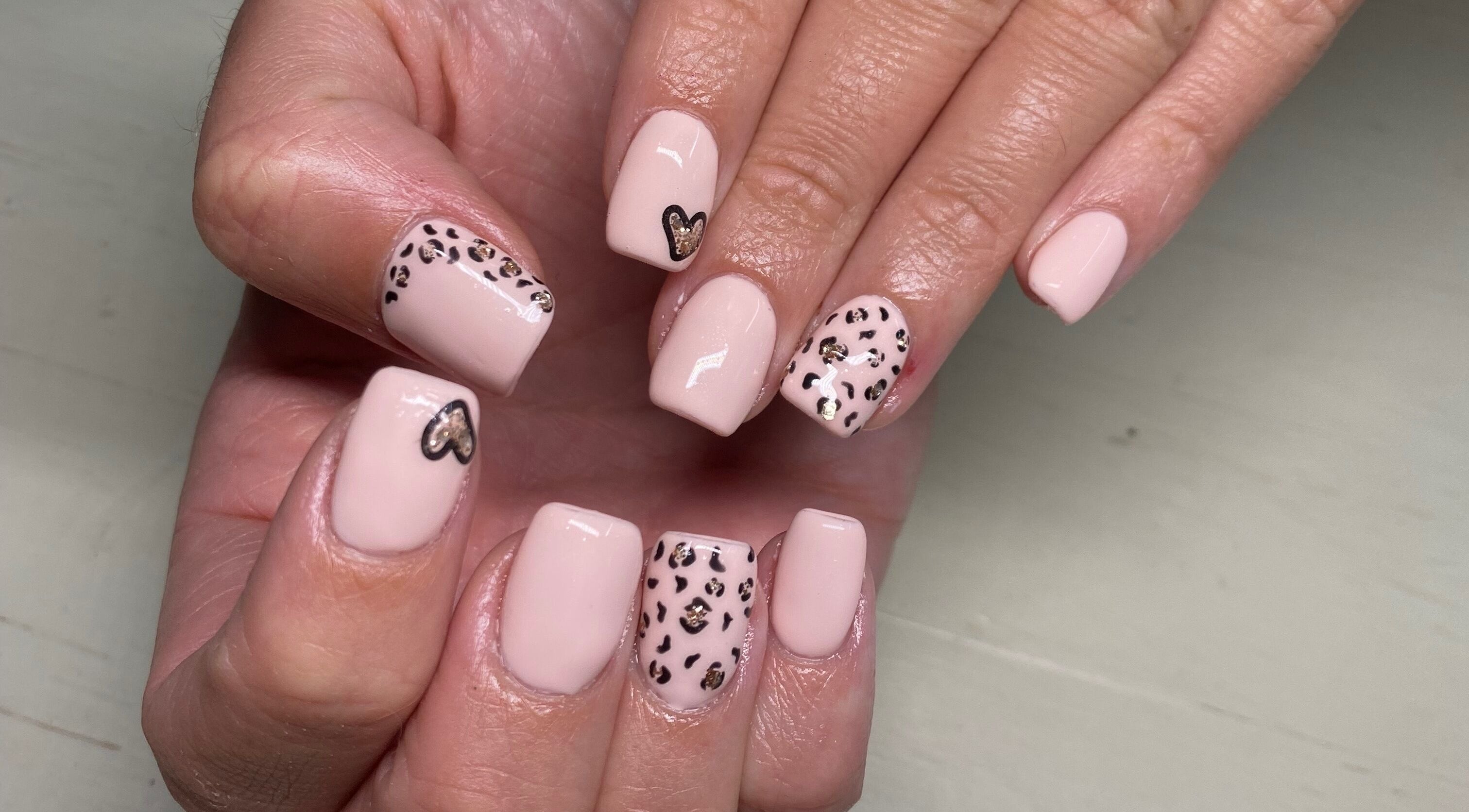 Elegant leopard print gel nails at Naked Nails, Pretoria, Gauteng, ZA. Perfect for a trendy, stylish look.