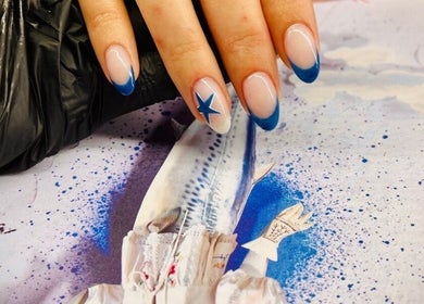 Elegant blue-tipped nails with star design at JEWLS Nails & Beauty, George, Western Cape, ZA.