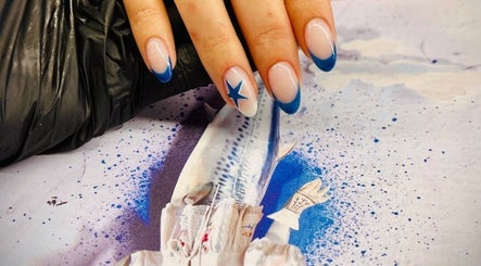 Elegant blue-tipped nails with star design at JEWLS Nails & Beauty, George, Western Cape, ZA.