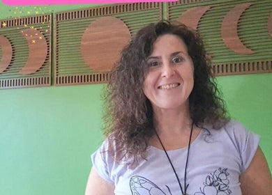 Giovanna Baistrocchi, Energy therapist at Craigavon, NI, in a serene room with moon decor.