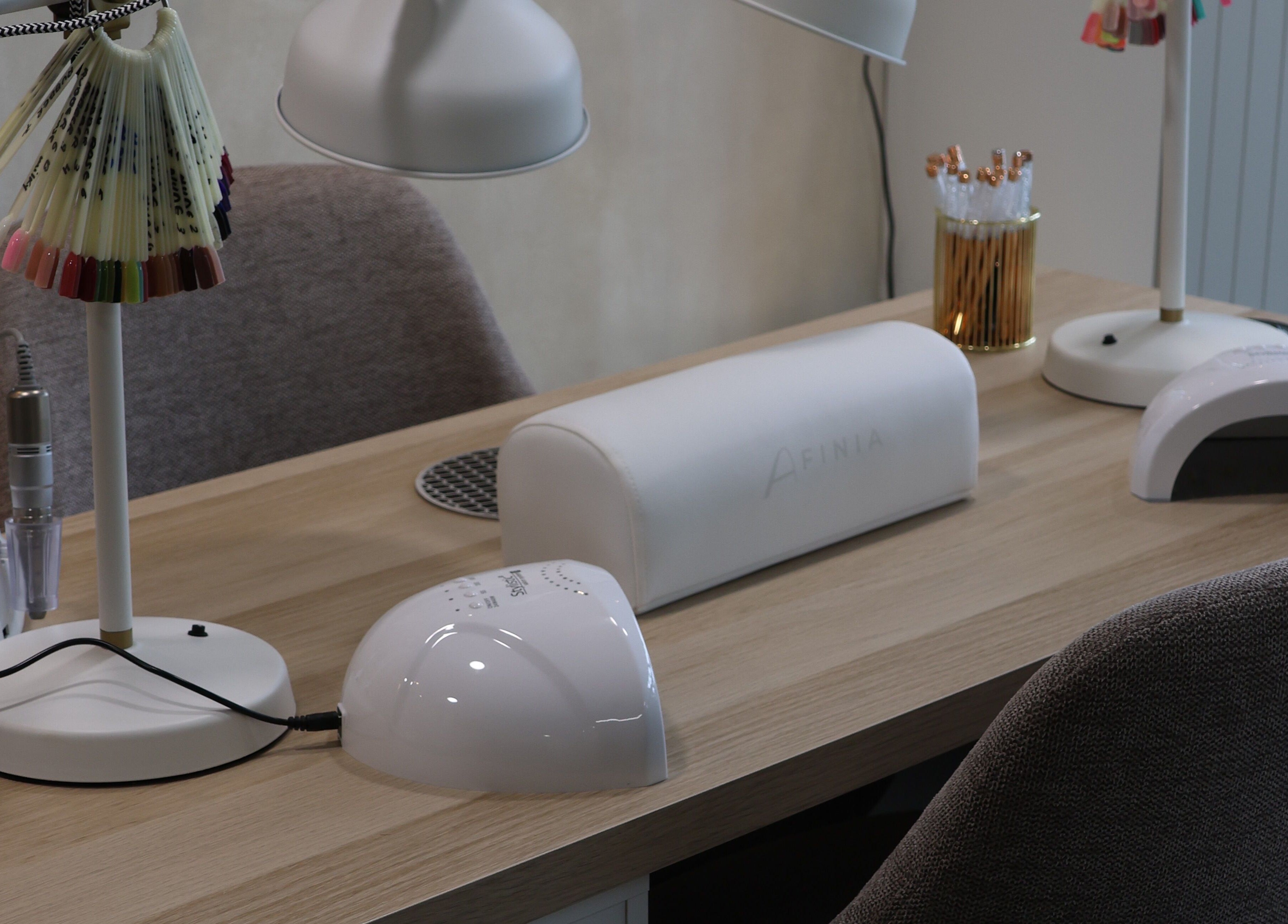 Nail station setup at Bloom Beauty, Tipperary, IE, showcasing modern manicure tools and polish samples.