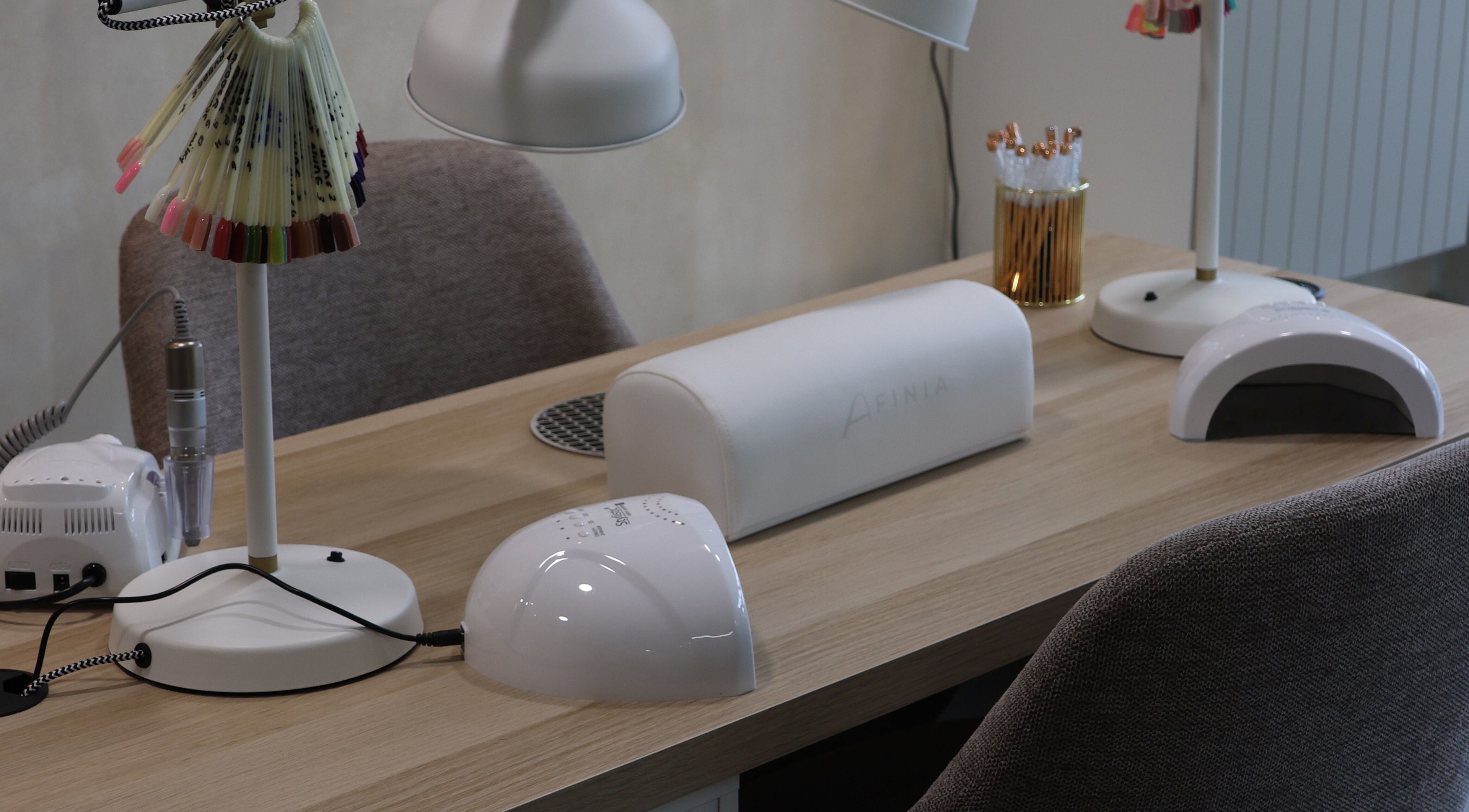 Nail station setup at Bloom Beauty, Tipperary, IE, showcasing modern manicure tools and polish samples.