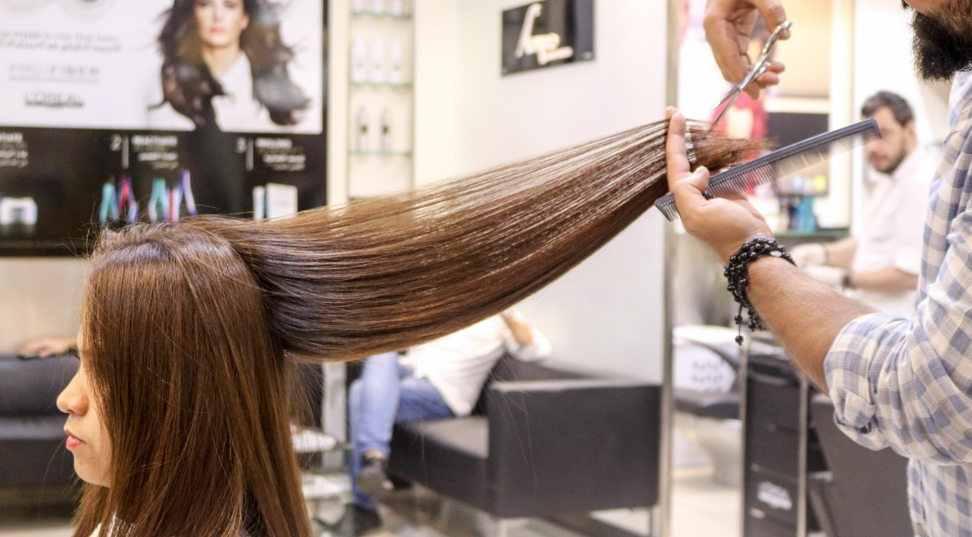 Stylist providing precision haircut at Amro - Hilton Dubai Palm Jumeirah, Dubai, Dubai, AE.